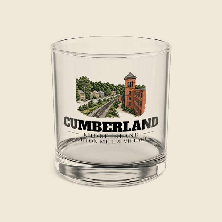 Cumberland Ashton Mill & Village rocks glass with colored engraving, shown on a cream background