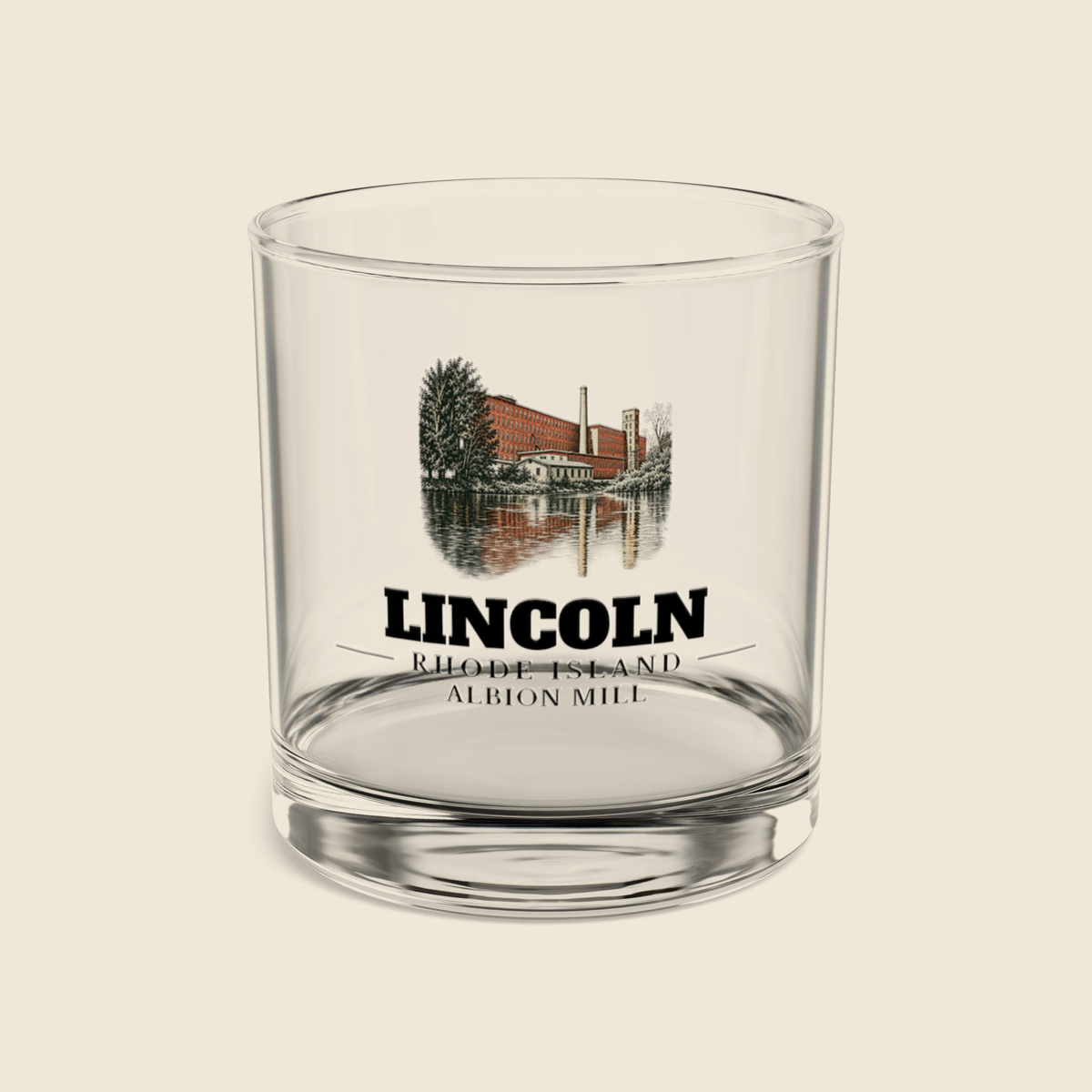 Lincoln Albion Mill rocks glass with colored engraving, shown on a cream background