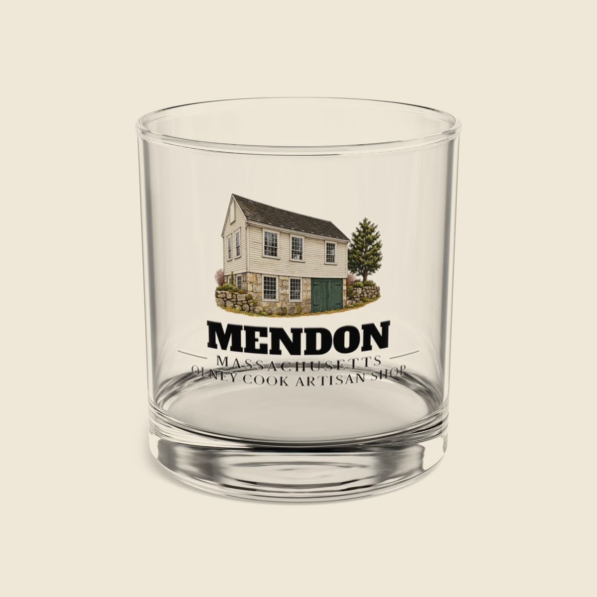 Mendon Olney Cook Artisan Shop rocks glass with colored engraving, shown on a cream background