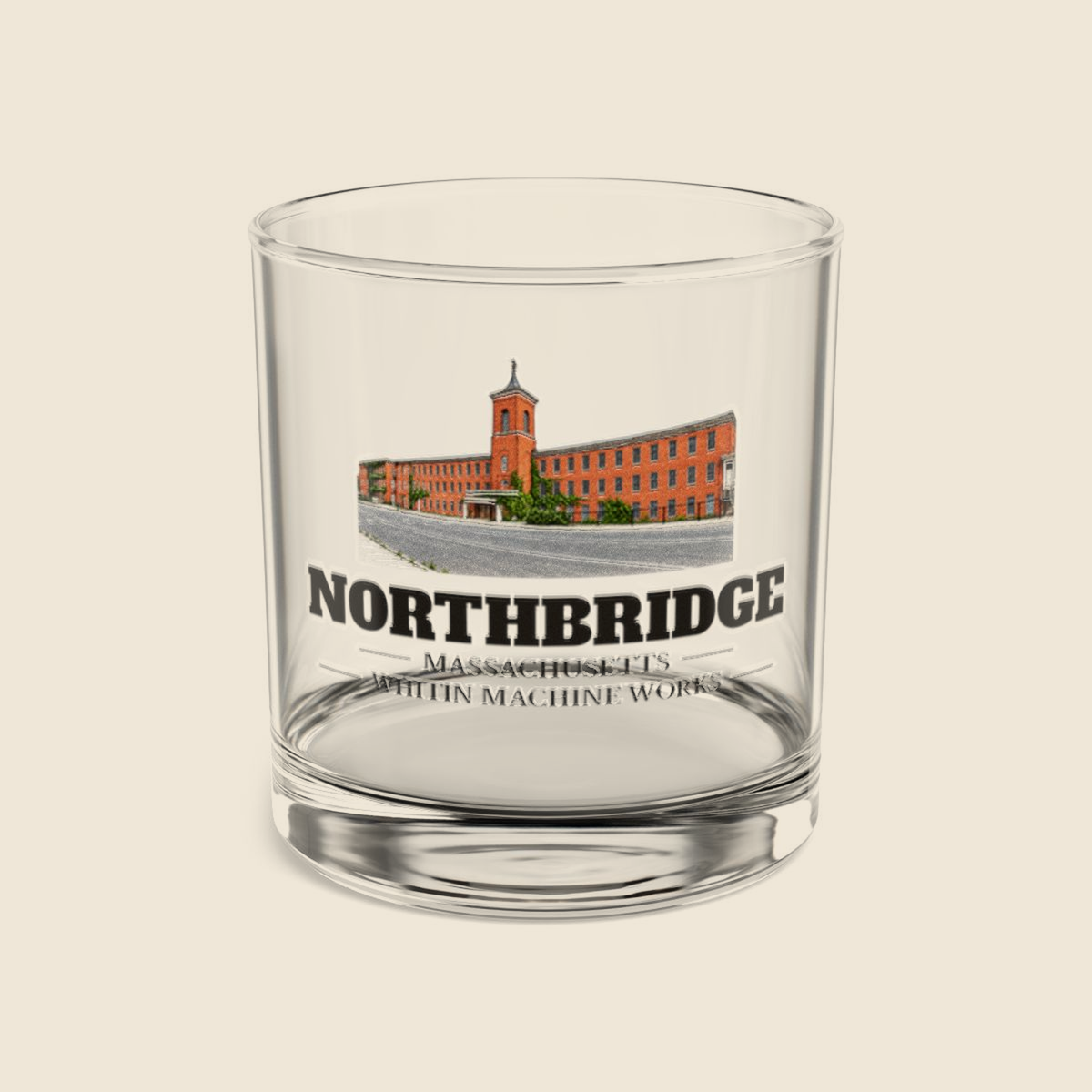 Northbridge Whitin Machine Works colored engraving on a 10 oz clear rocks glass, cream display background