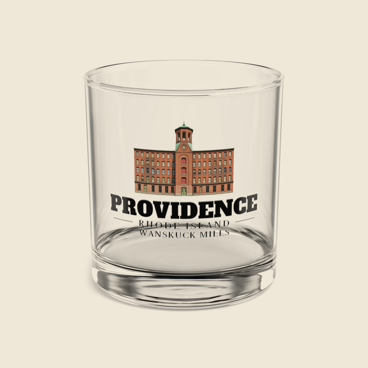 Providence Wanskuck Mills rocks glass with colored engraving, shown on a cream background